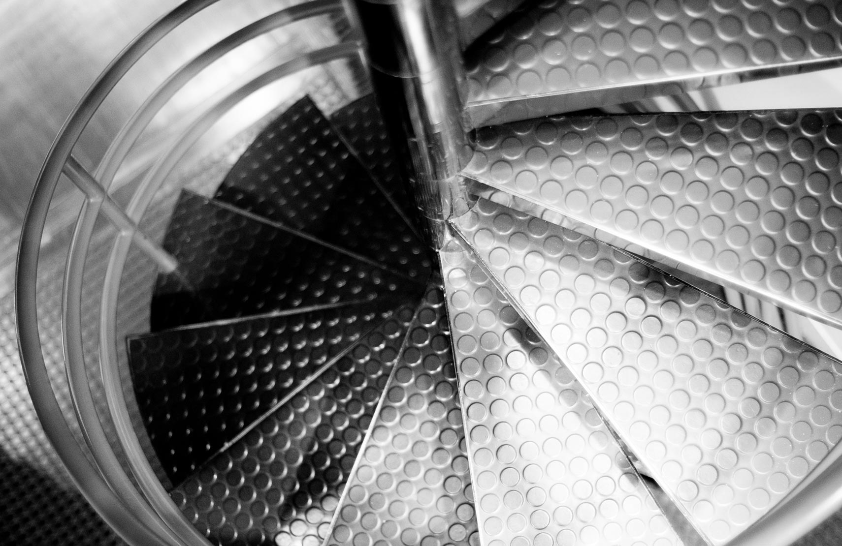 The spiral staircase in Sametz Blackstone Associates in black and white
