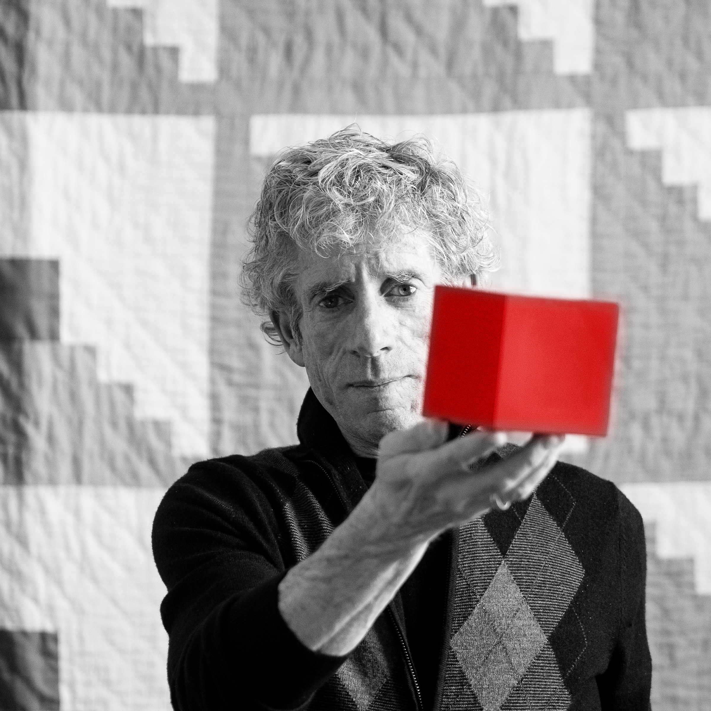 Roger holding a red cube